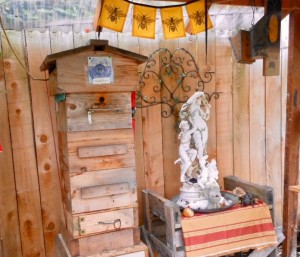 In this Warre hive, a quilt box on top of the uppermost box absorbs moisture and keeps it from falling on the heads of the bees in winter. The hive is managed by the box, not often by the comb.