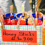 "Honey Sticks" sign with product.
